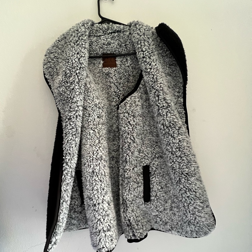 C.C reversible Fur vest with pockets.